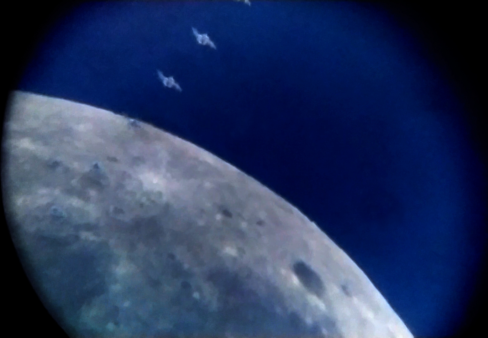 The ISS flying by the moon